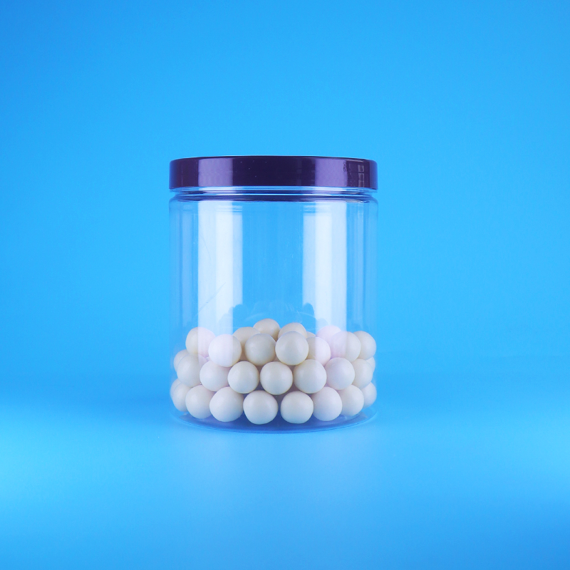 खाद्य ग्रेड एयरटाइट लंबा गोल स्पष्ट पीईटी प्लास्टिक स्वीट ड्राई फूड जार स्क्रू फ्लैट ढक्कन