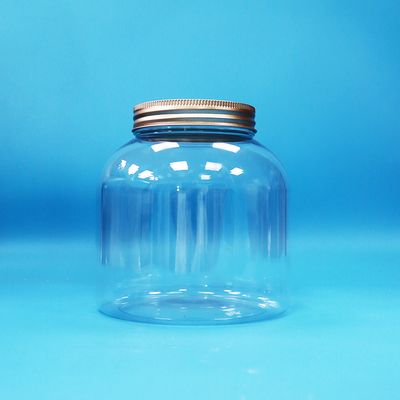 पर्यावरण के अनुकूल पारदर्शी प्लास्टिक पीईटी गोल कैंडी दैनिक खाद्य जार एल्यूमीनियम पेंच ढक्कन